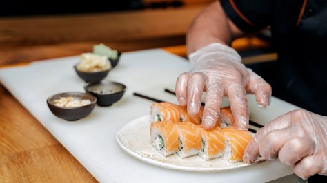Chef making salmon roll